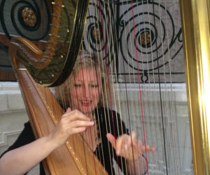 woman playing a harp