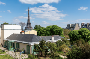 A one storey house in Paris with the Eiffel Tower in the background. The house belonged to the writer, Balzac